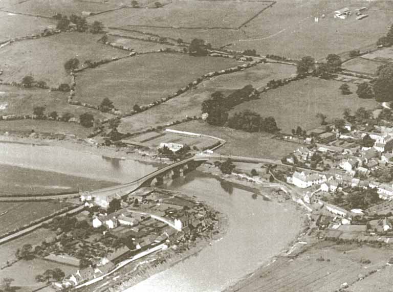 Aerial photograph of Caerleon - 1920s - Showing the amphitheatre field before excavation, the racecourse and the bridge over the River Usk.