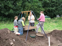 Sieving the soil for small artefacts