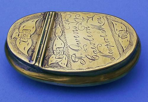 Brass tobacco tin with hinged lid. Well decorated and bearing the name R Owens Caerleon Newport Mon