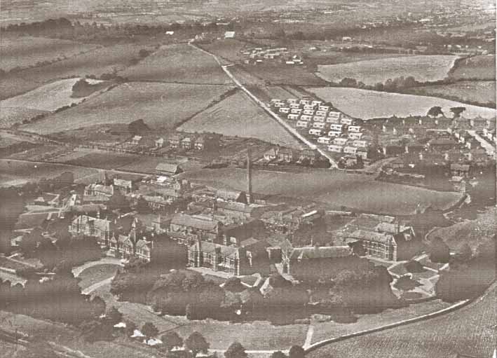 Aerial photograph of Lodge Hill Caerleon. Showing prefabs, early development of housing, Saint Cadoc's Hospital and Lodge Road.