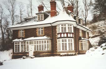 Clawdd with a dusting of snow. It is said that Colonel Lyne lived in the room at the bottom of the turret and that he slept in his old army bed there.
