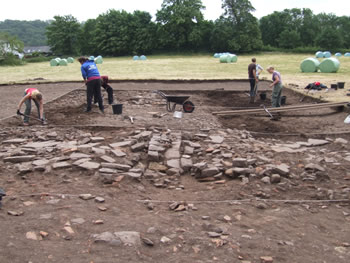 What is thought to be part of the outside wall of the warehouse, it is thought that there was an open courtyard to the right.