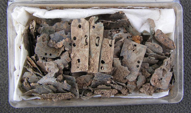 Some of the loose items collected before block lifting a large mass containing armour at the 2010 Caerleon archaeological dig.