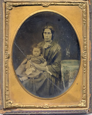 Very old glass slide dated 1857. It shows Ann Evans, wife of Joseph Evans a lime burner from Caerleon, and her granddaughter Louisa Caroline Evans, daughter of William Downing Evans, Leon - the Bard of Newport.